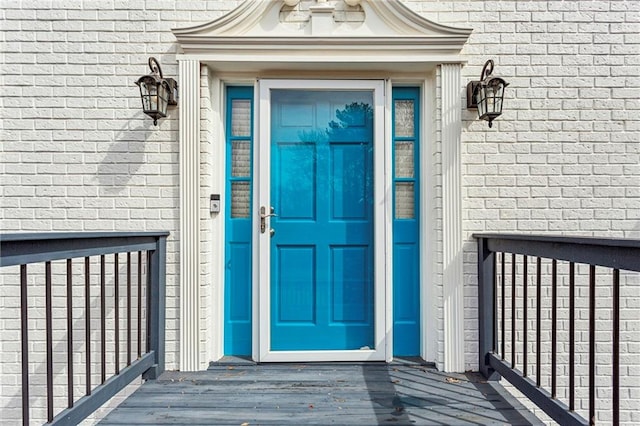 property entrance with brick siding