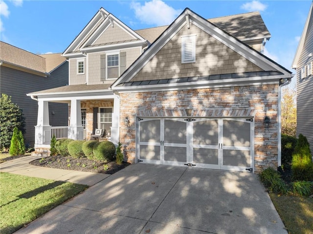 craftsman house featuring a porch and a garage