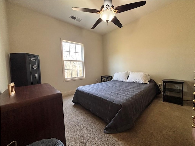 bedroom featuring visible vents, carpet floors, baseboards, and ceiling fan