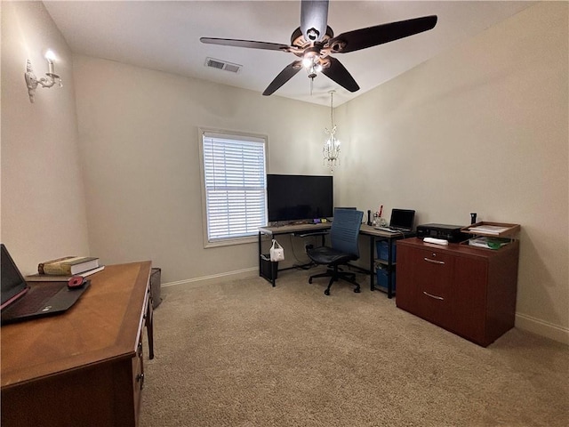 office space featuring a ceiling fan, light colored carpet, visible vents, and baseboards