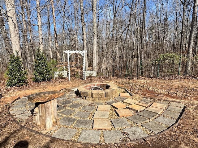 view of patio with an outdoor fire pit