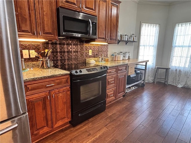 kitchen with backsplash, stainless steel appliances, ornamental molding, and dark wood-style flooring