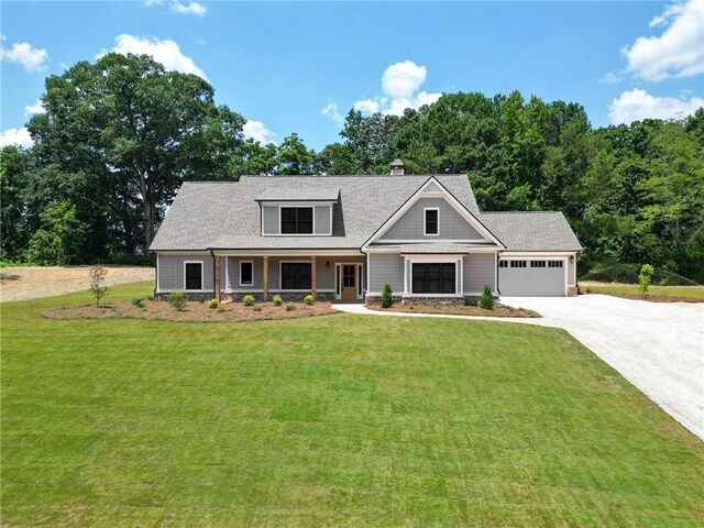 492 Nunnally Farm Rd, Monroe, GA 30655 - craftsman-style home featuring driveway, an attached garage, a front lawn, and a chimney