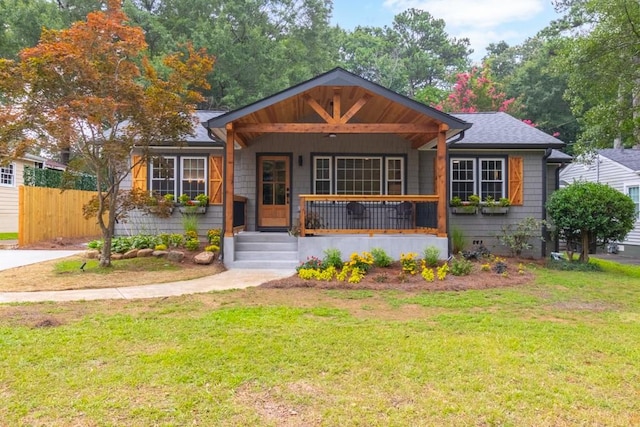 bungalow-style house with a porch and a front yard