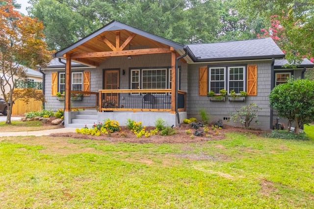 bungalow-style house with a front yard