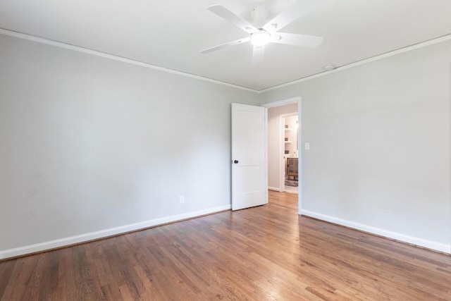 unfurnished room featuring crown molding, ceiling fan, and wood-type flooring