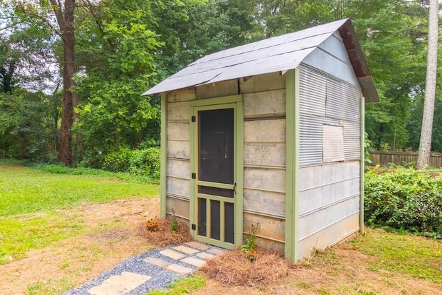 view of outbuilding with a lawn