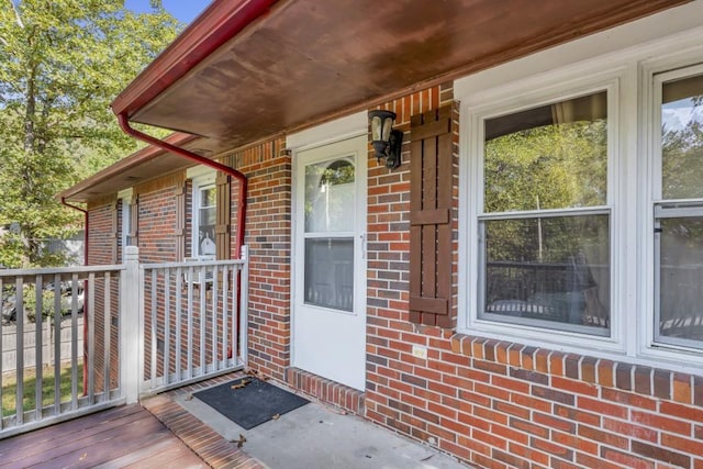 doorway to property featuring a wooden deck