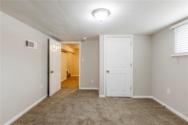 unfurnished bedroom with carpet flooring