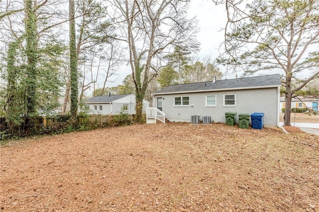 back of house featuring central AC unit