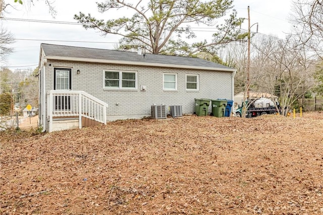 back of property with central AC unit