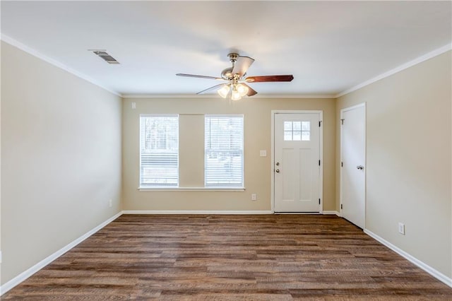 foyer with crown molding, ceiling fan, and dark hardwood / wood-style flooring