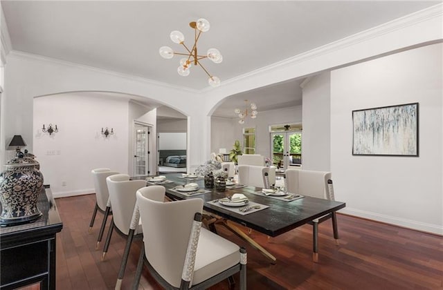 dining space featuring a notable chandelier, french doors, ornamental molding, and dark hardwood / wood-style flooring