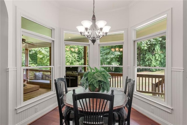 sunroom with an inviting chandelier