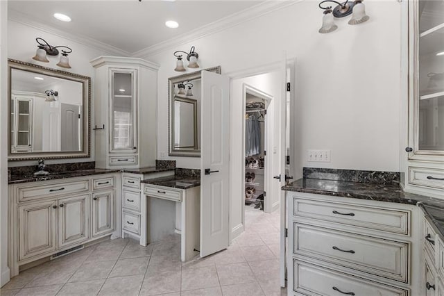 bathroom with tile patterned flooring and ornamental molding