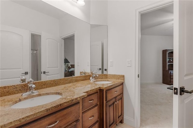 bathroom with a shower and vanity