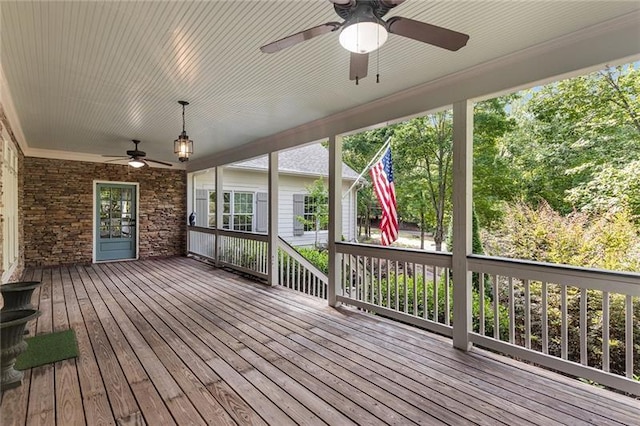 wooden deck featuring ceiling fan