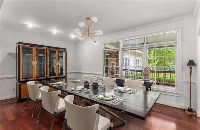 dining room featuring ornamental molding, dark hardwood / wood-style floors, and an inviting chandelier