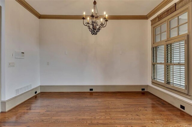 4853 Stonehall Pl, Atlanta, GA 30339 - spare room with ornamental molding, a chandelier, wood finished floors, and baseboards