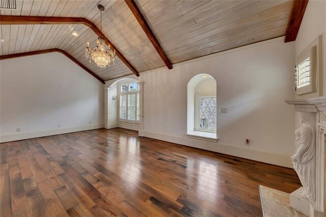 4853 Stonehall Pl, Atlanta, GA 30339 - unfurnished living room featuring a chandelier, arched walkways, wood ceiling, wood-type flooring, and baseboards