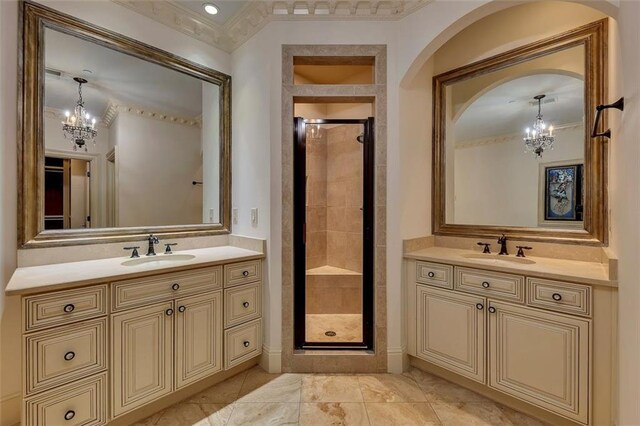 4853 Stonehall Pl, Atlanta, GA 30339 - full bath with a chandelier, a stall shower, ornamental molding, and two vanities