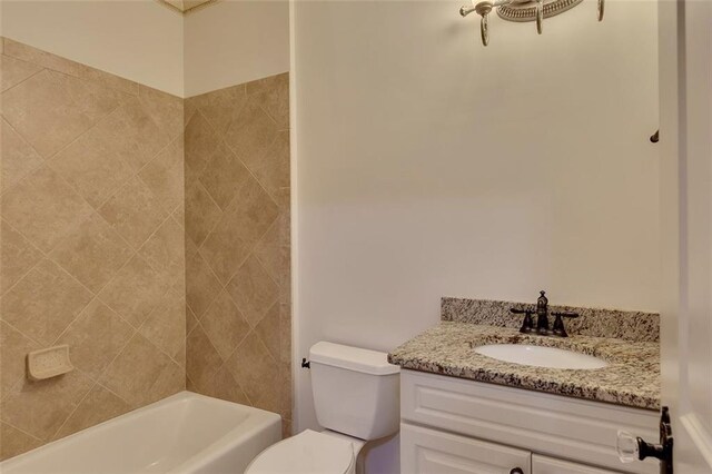 4853 Stonehall Pl, Atlanta, GA 30339 - bathroom featuring toilet, vanity, and shower / washtub combination