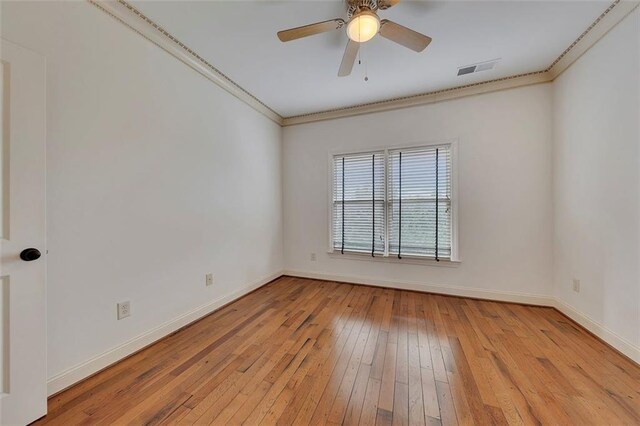 4853 Stonehall Pl, Atlanta, GA 30339 - empty room with hardwood / wood-style flooring, baseboards, crown molding, and a ceiling fan