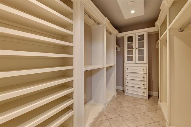 4853 Stonehall Pl, Atlanta, GA 30339 - spacious closet featuring light tile patterned floors