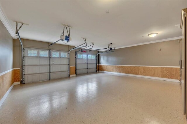 4853 Stonehall Pl, Atlanta, GA 30339 - garage featuring a garage door opener, wainscoting, and baseboards