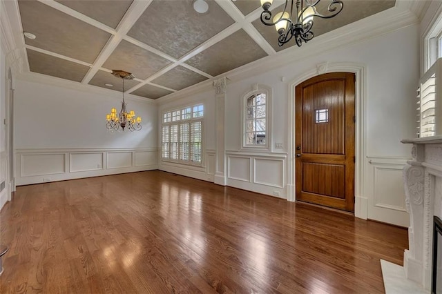 4853 Stonehall Pl, Atlanta, GA 30339 - entrance foyer with a chandelier, a decorative wall, coffered ceiling, a premium fireplace, and wood finished floors