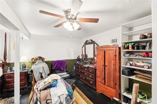 bedroom featuring visible vents, a ceiling fan, and wood finished floors