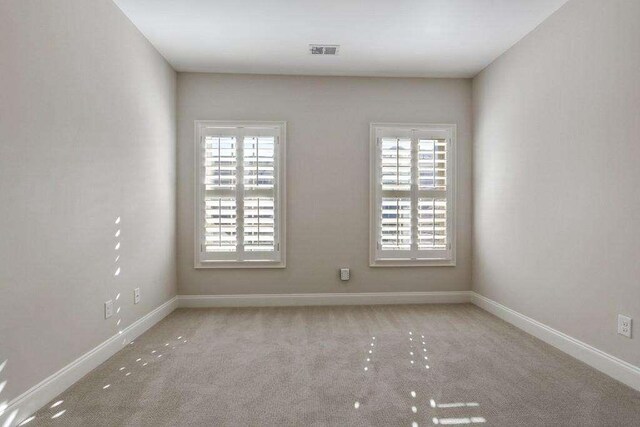 1117 Cordia Ave, Atlanta, GA 30318 - carpeted empty room featuring healthy amount of natural light