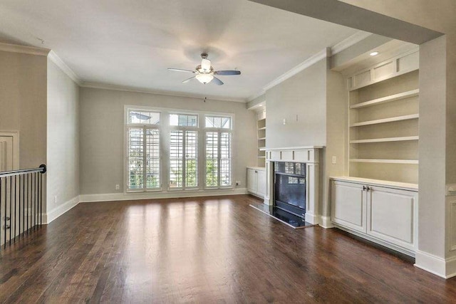 1117 Cordia Ave, Atlanta, GA 30318 - unfurnished living room featuring a high end fireplace, a ceiling fan, ornamental molding, built in features, and dark wood-type flooring