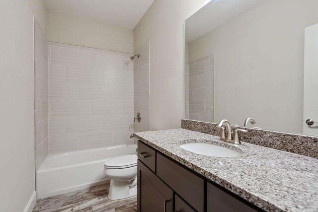 1117 Cordia Ave, Atlanta, GA 30318 - full bathroom featuring vanity, wood finished floors, and shower / tub combination