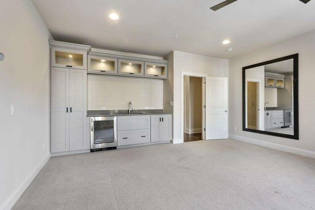 1117 Cordia Ave, Atlanta, GA 30318 - indoor wet bar with beverage cooler, light colored carpet, and recessed lighting