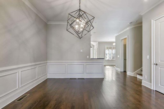 1117 Cordia Ave, Atlanta, GA 30318 - unfurnished dining area featuring crown molding, a chandelier, dark wood-style flooring, stairway, and wainscoting