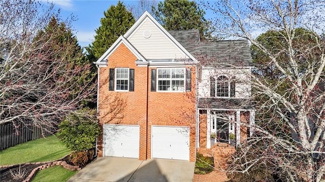 view of front facade featuring a garage, concrete driveway, brick siding, and fence