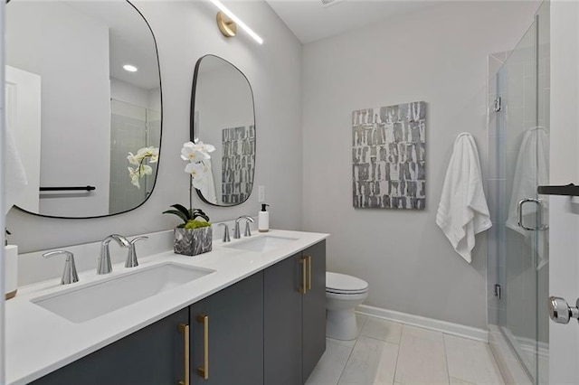 bathroom with tile patterned flooring, vanity, toilet, and an enclosed shower