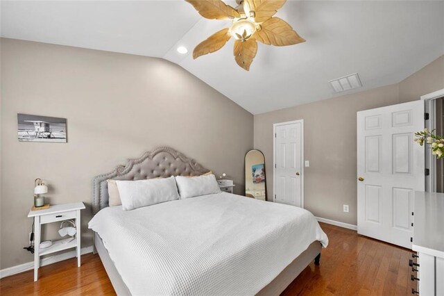 3542 Chattahoochee Summit Ln SE, Atlanta, GA 30339 - bedroom featuring vaulted ceiling, baseboards, wood finished floors, and a ceiling fan