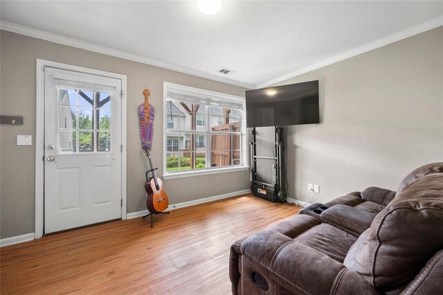 3542 Chattahoochee Summit Ln SE, Atlanta, GA 30339 - living area with crown molding, baseboards, and wood finished floors