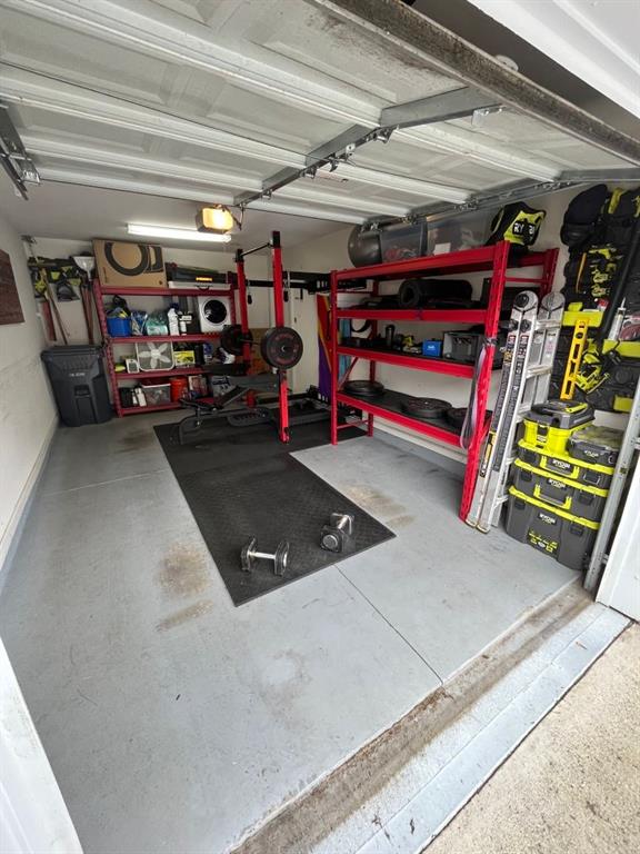 3542 Chattahoochee Summit Ln SE, Atlanta, GA 30339 - garage featuring a garage door opener