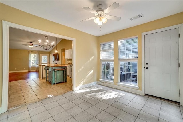209 Jacobs Way, Jasper, GA 30143 - foyer entrance featuring light tile patterned floors, a ceiling fan, and a chandelier