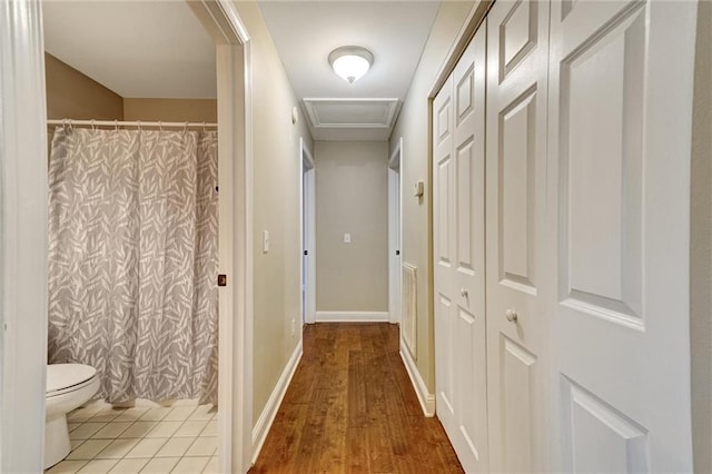209 Jacobs Way, Jasper, GA 30143 - corridor featuring wood finished floors and attic access