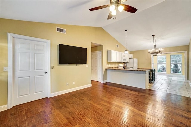 209 Jacobs Way, Jasper, GA 30143 - unfurnished living room with ceiling fan, vaulted ceiling, a chandelier, and hardwood / wood-style flooring