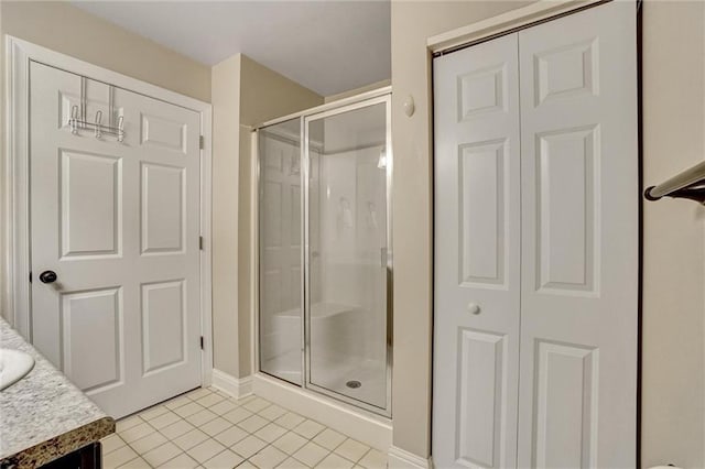 209 Jacobs Way, Jasper, GA 30143 - bathroom featuring tile patterned floors, a stall shower, vanity, and a closet