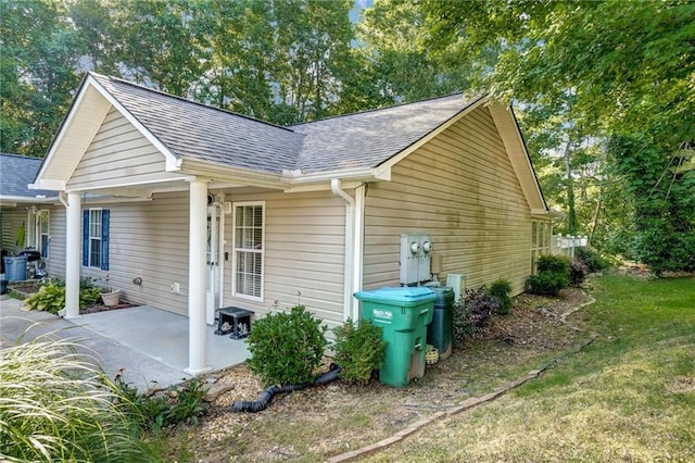 209 Jacobs Way, Jasper, GA 30143 - view of side of home featuring a shingled roof and a patio area