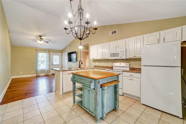 209 Jacobs Way, Jasper, GA 30143 - kitchen featuring white appliances, white cabinets, lofted ceiling, a ceiling fan, and a peninsula