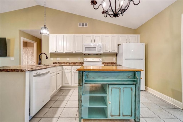 209 Jacobs Way, Jasper, GA 30143 - kitchen featuring white appliances, vaulted ceiling, white cabinetry, a chandelier, and light tile patterned floors