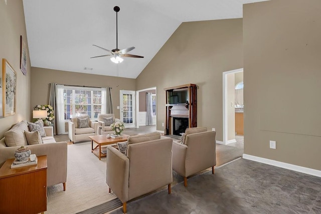 living room with ceiling fan and high vaulted ceiling