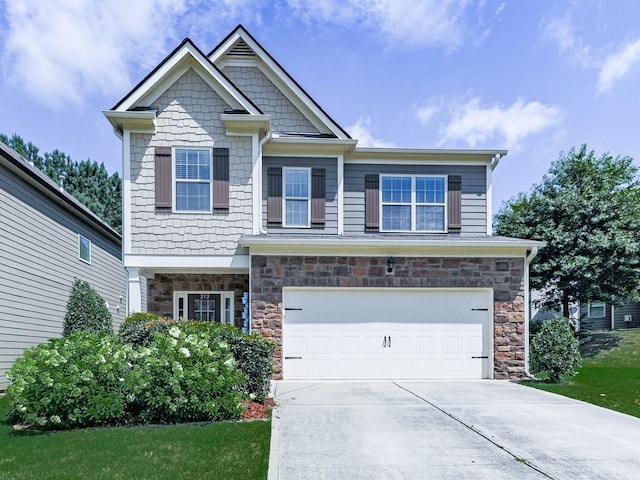 212 Torch Dr, Acworth, GA 30102 - craftsman-style home with a garage, stone siding, and concrete driveway